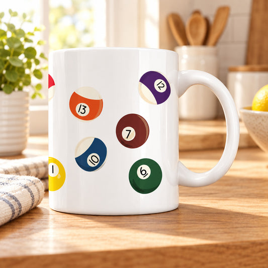 A white ceramic mug featuring a pattern of colorful 9-ball pool cues in various colors and numbers, shown against a plain white background.