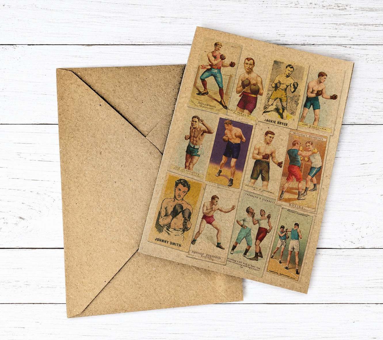 A vintage-style boxing collectible card sheet with 12 illustrated cards of boxers, shown on a white wood background next to a brown kraft envelope.
